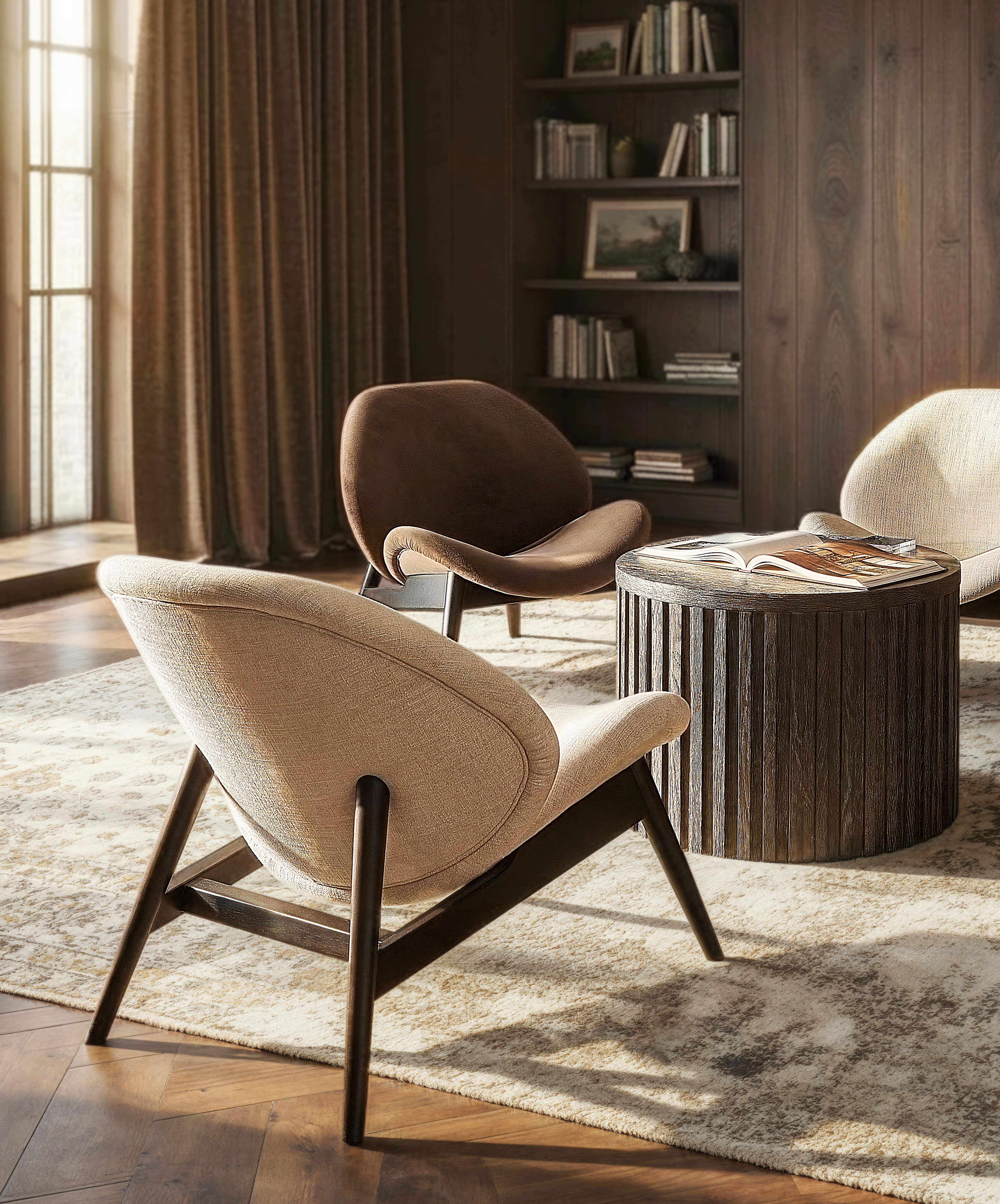 Lounge chairs and occasional table in a sunlit room